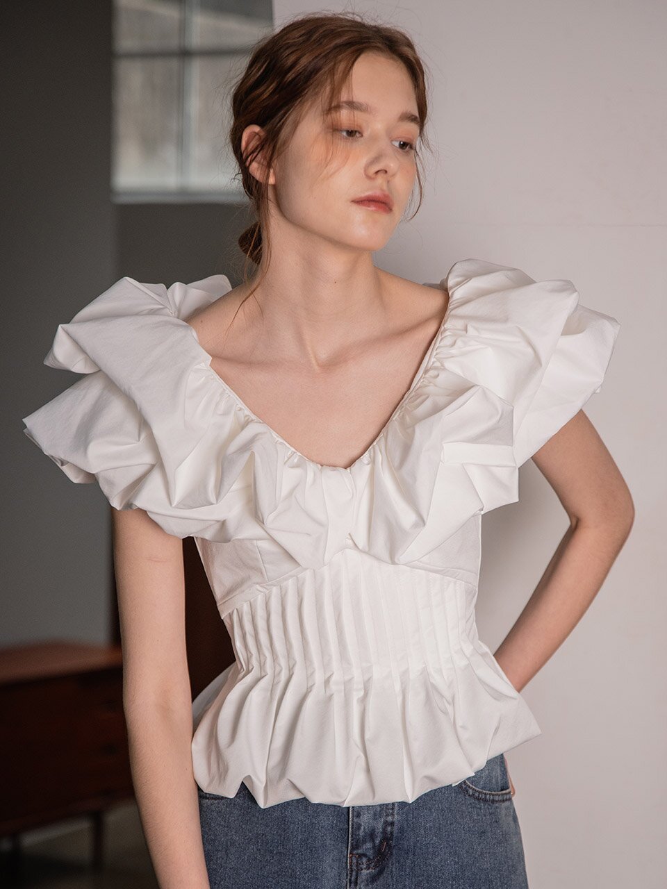 Flounced and irregularly pleated top
