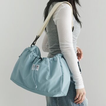 커들리 스트링 포켓 크로스백 - skyblue