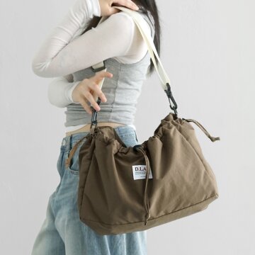 커들리 스트링 포켓 크로스백 - cocoa